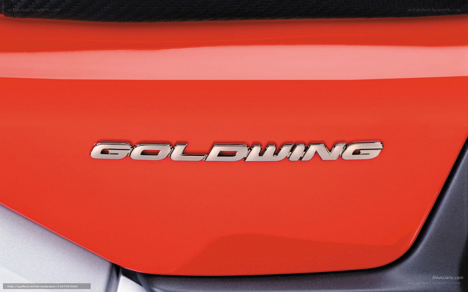 Goldwing emblem on red motorcycle