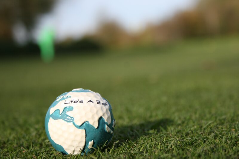 golf ball with life's a ball text
