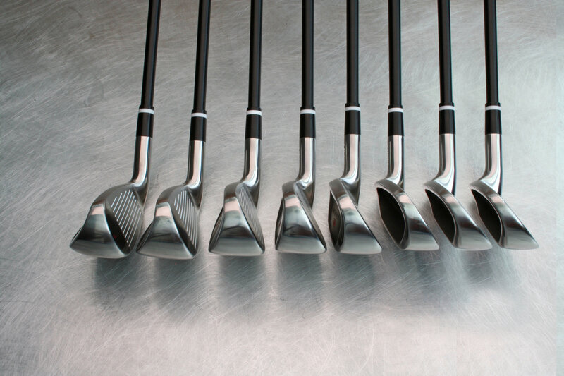 golf clubs in a row