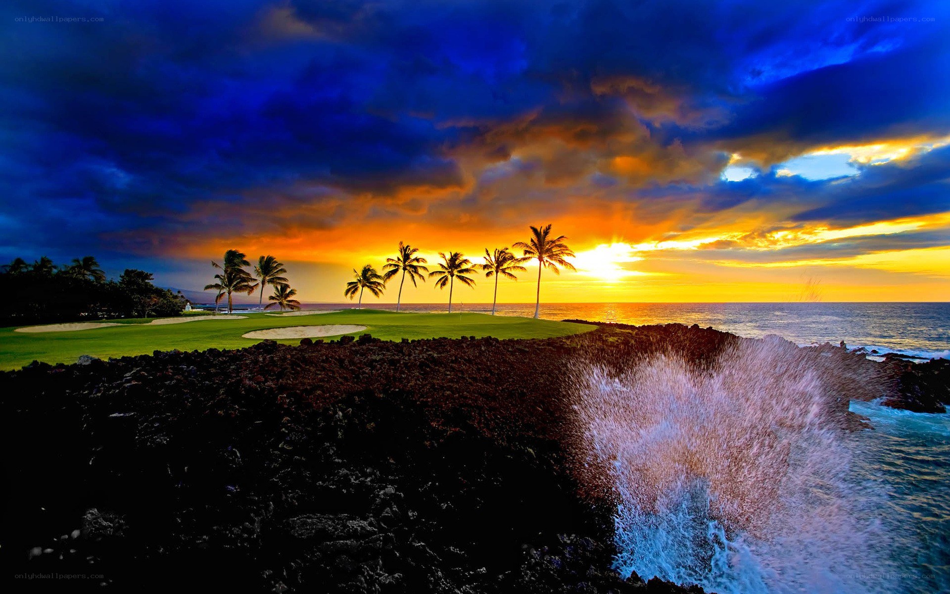 Golf course at sunset with ocean waves