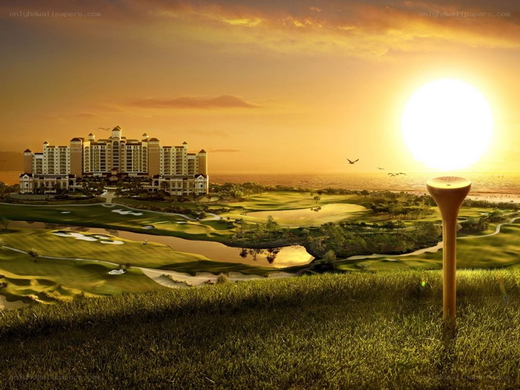 Golf course at sunset with resort