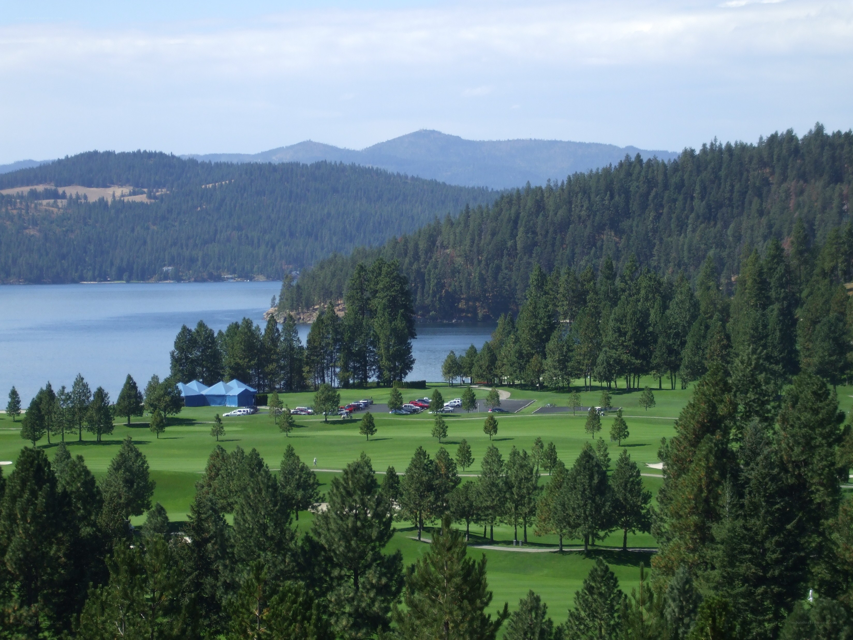 Golf course by a lake