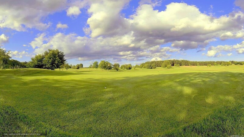 Golf course under cloudy sky