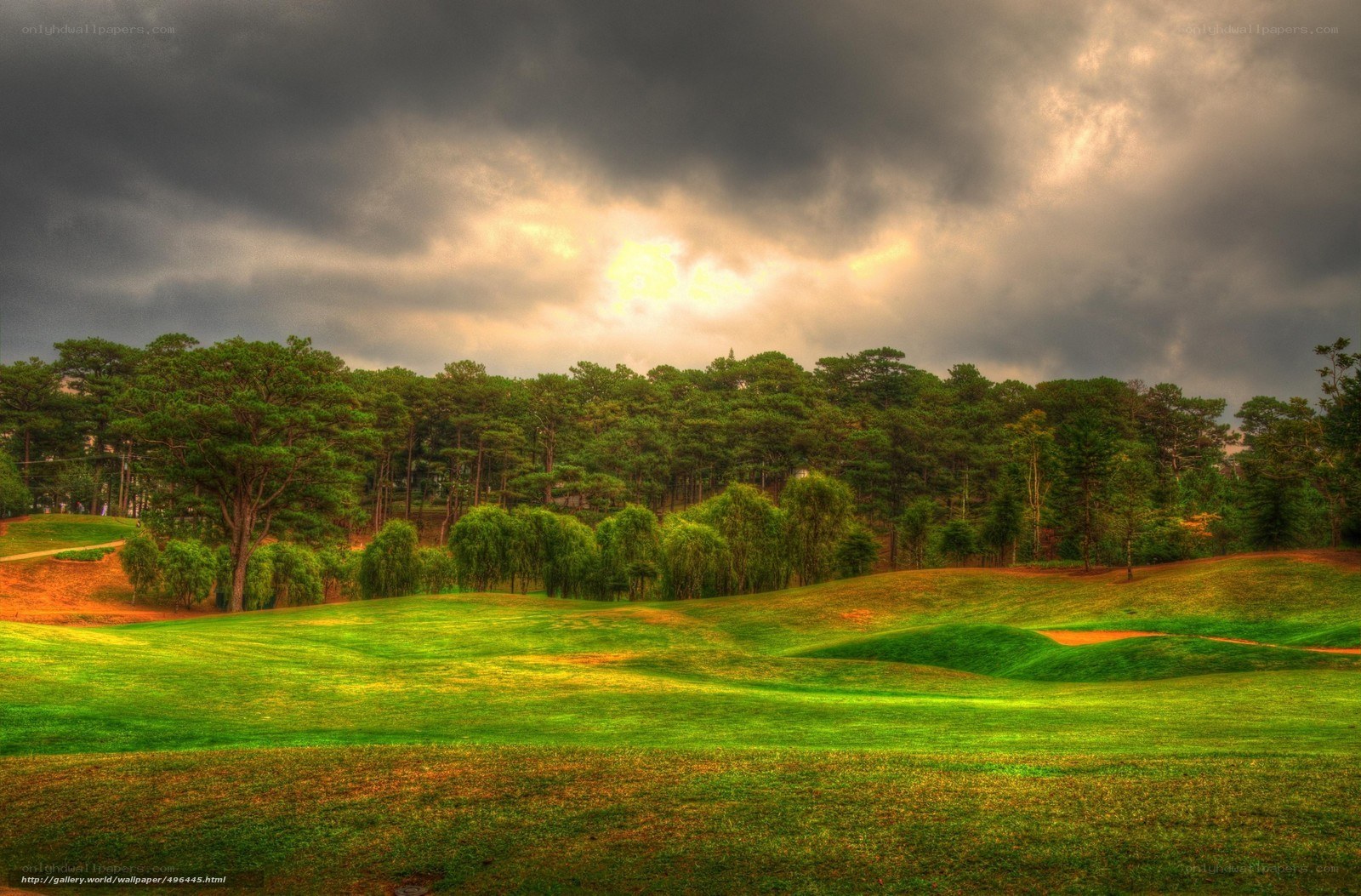 Golf course under stormy sky