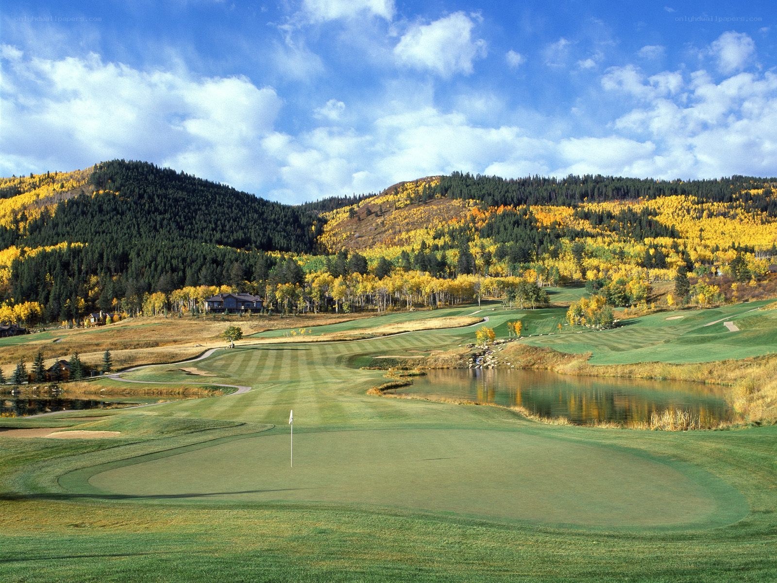 Golf course with autumn mountains