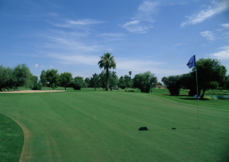 Golf course with blue flag