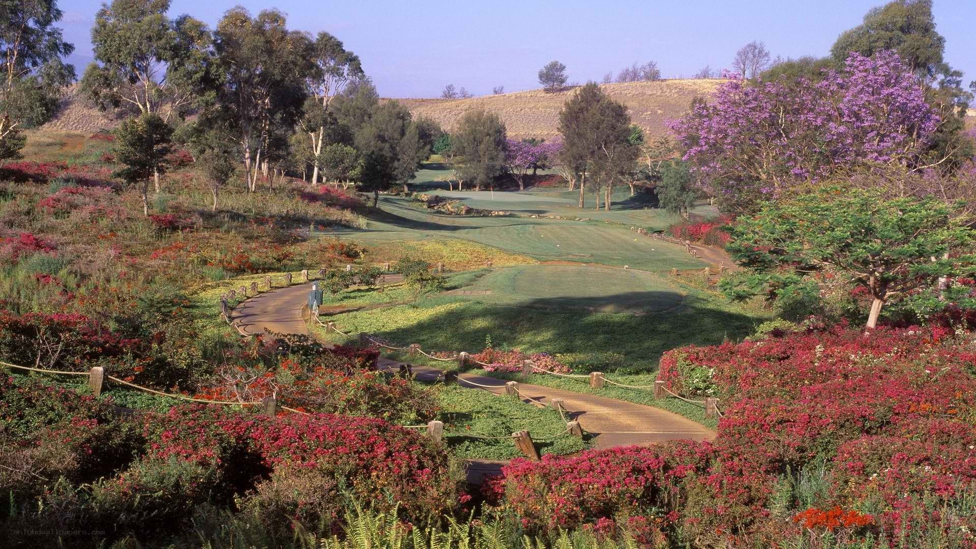 Golf course with colorful flowers