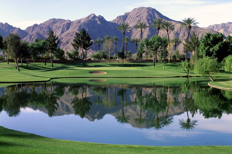 Golf course with mountain reflection