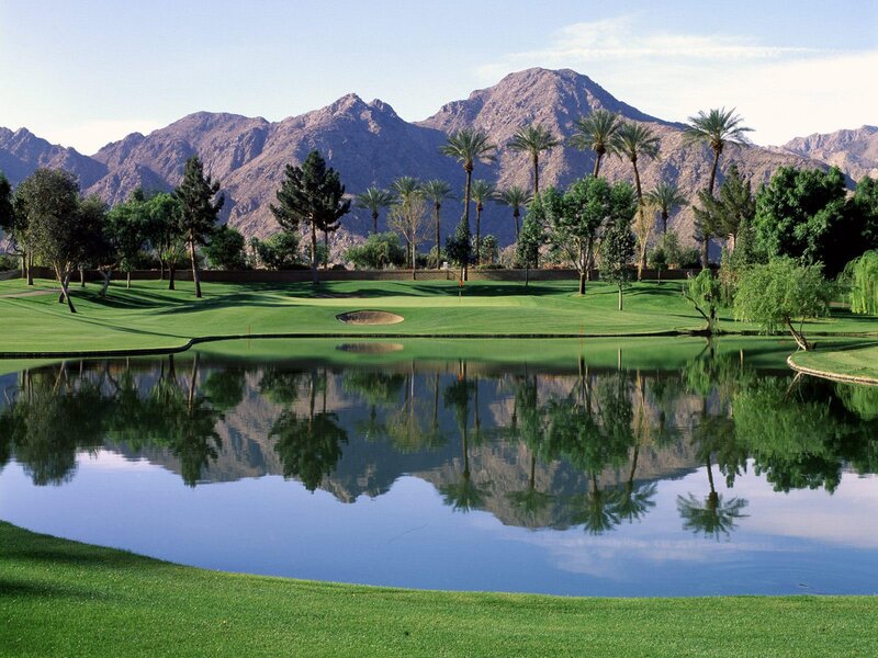 Golf course with mountain reflection