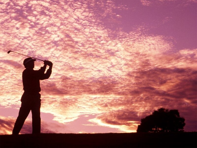 Golfer at sunset