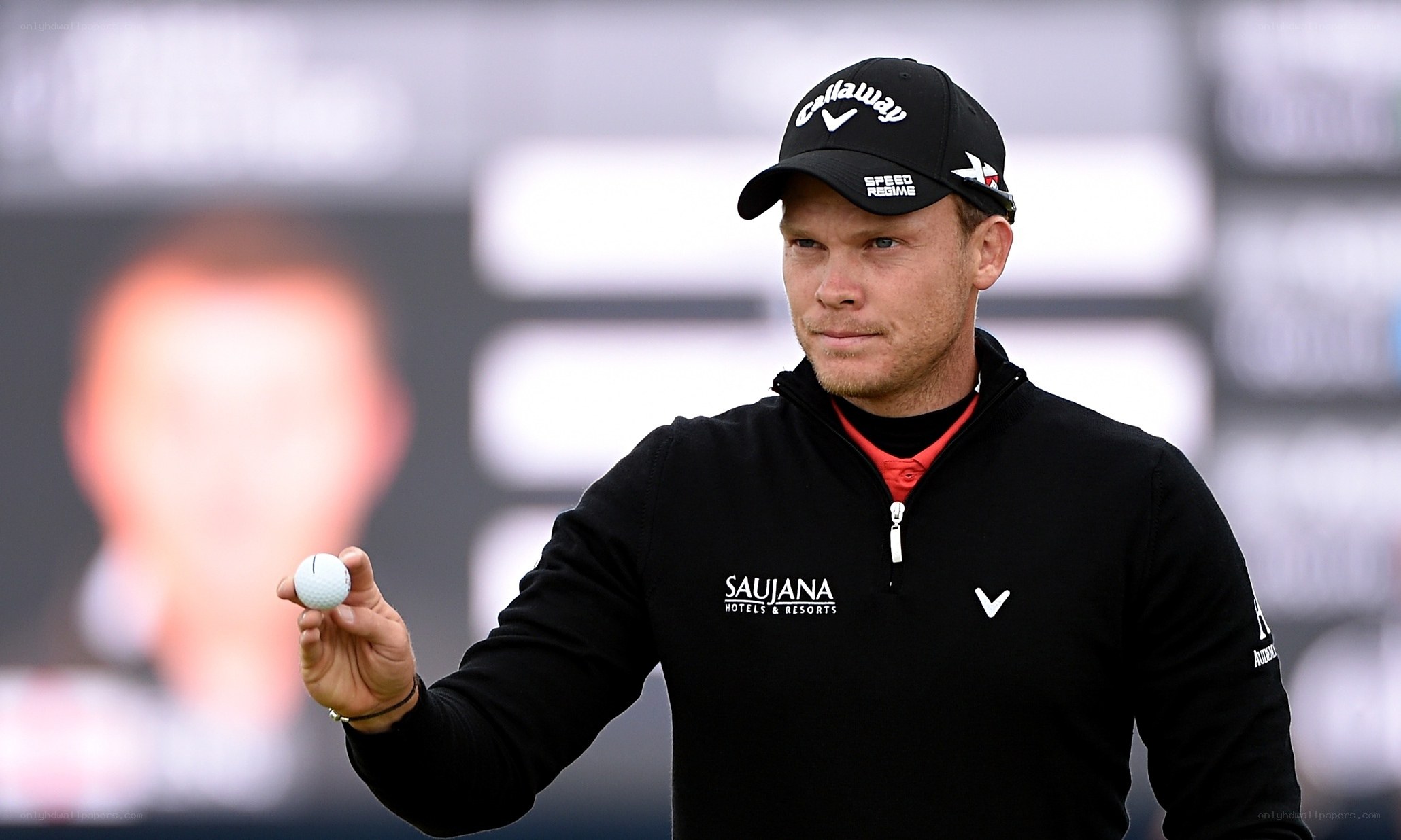 golfer holding a ball