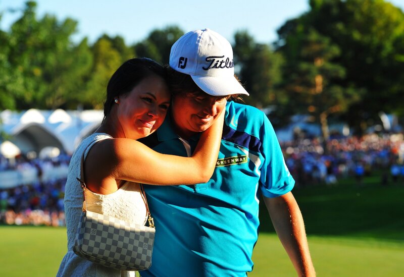 Golfer hugging partner