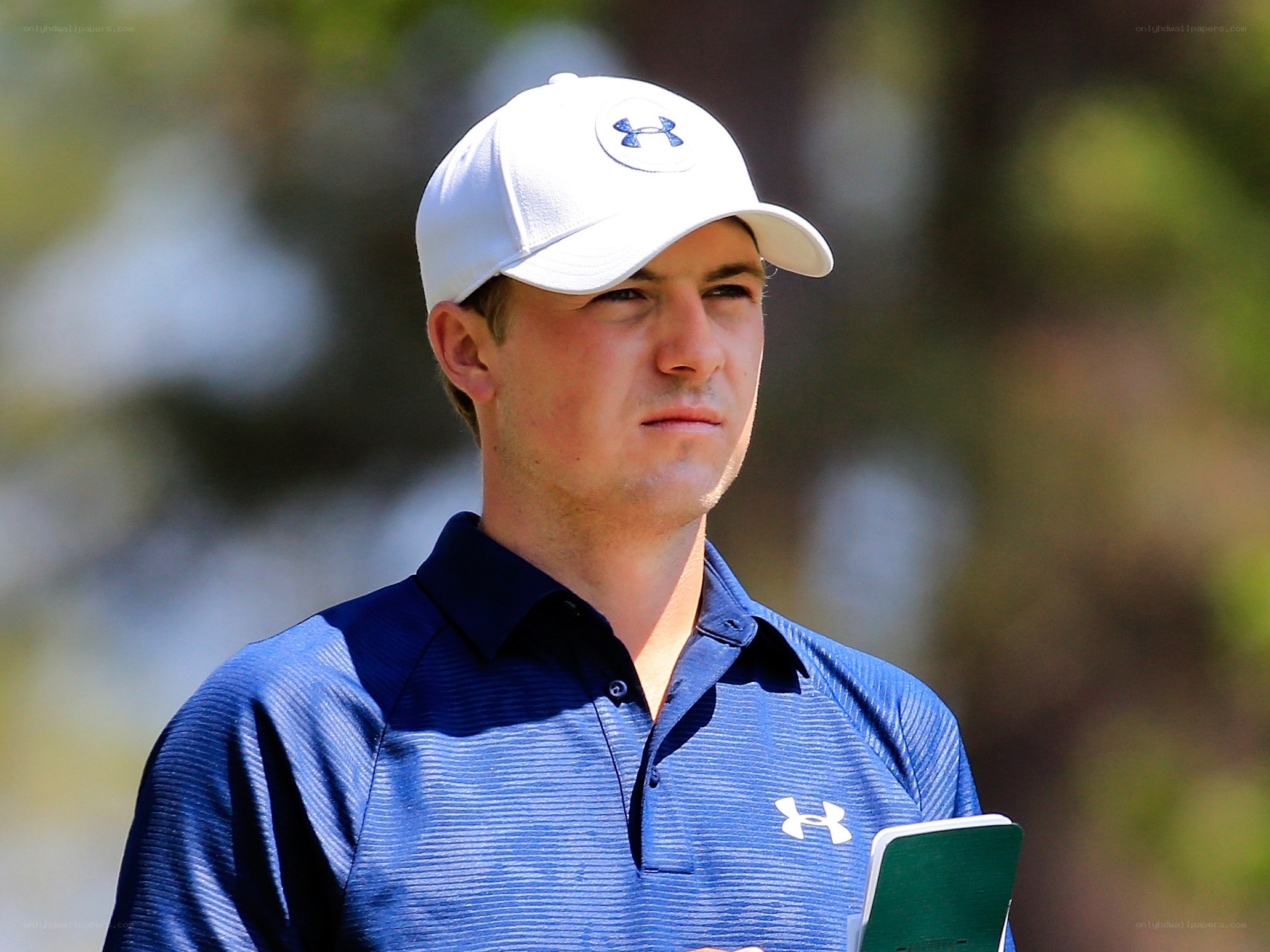 golfer in blue shirt