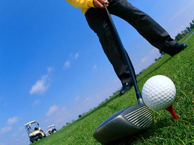 Golfer preparing to tee off