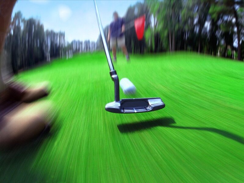 Golfer Putting on Green — Active