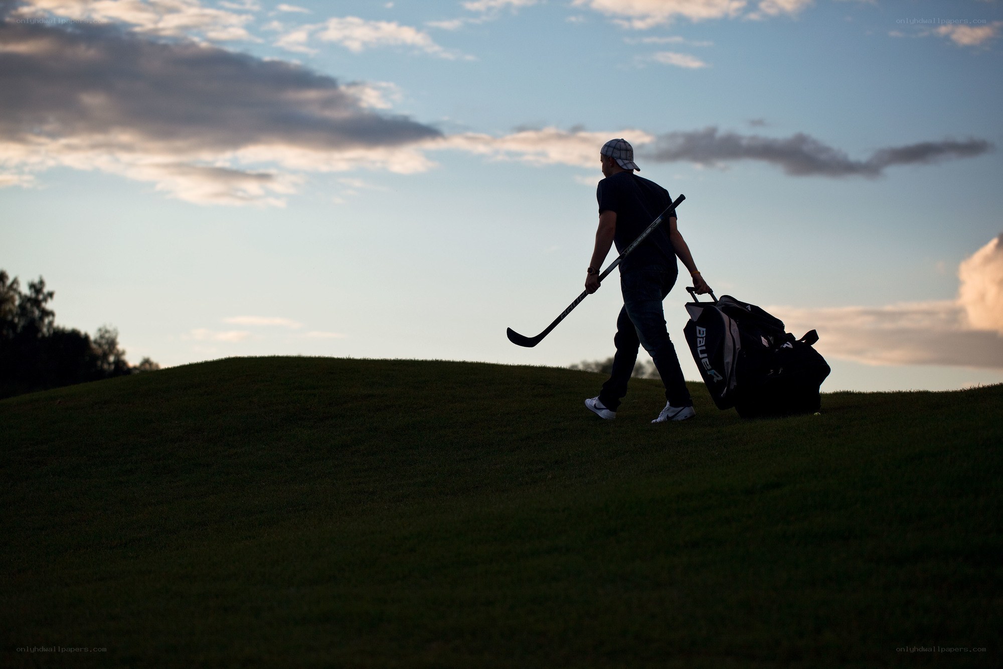 Golfer walking with clubs