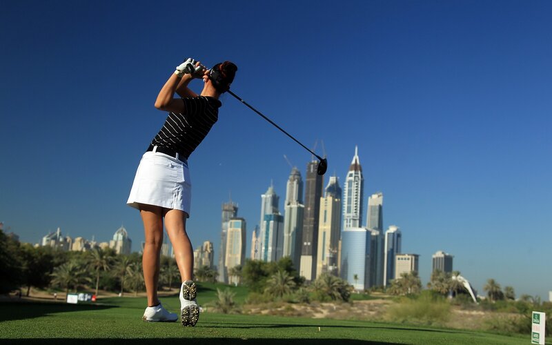 Golfer with city skyline