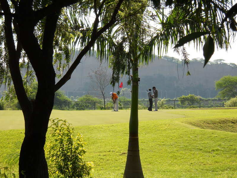 Golfers on a Green — Serene