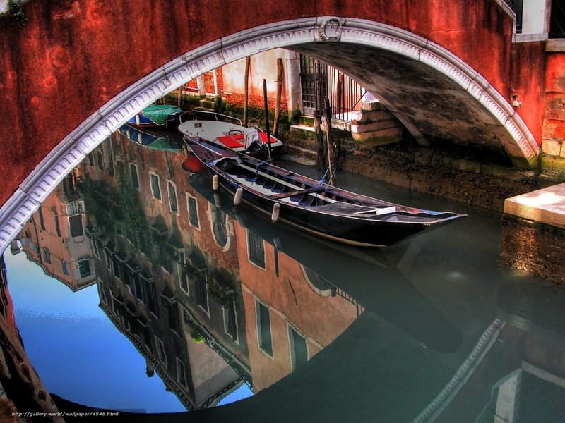 Gondola under a red bridge