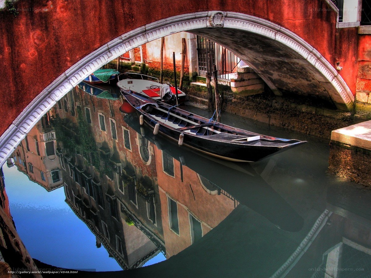 Gondola under a red bridge