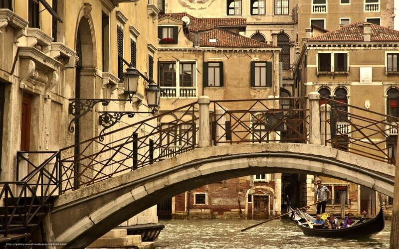Gondola under a Venetian bridge