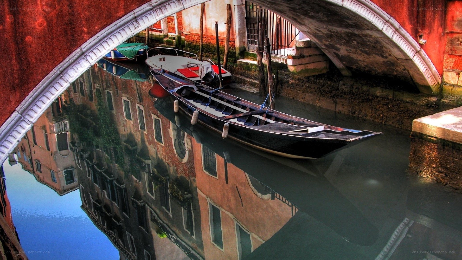 Gondola under a Venetian bridge