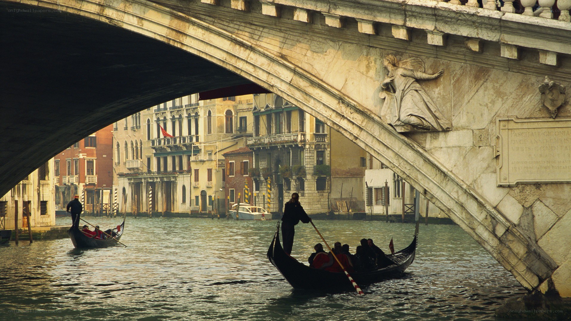 Gondolas under a Venetian bridge