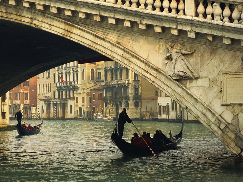 Gondolas under a Venetian bridge