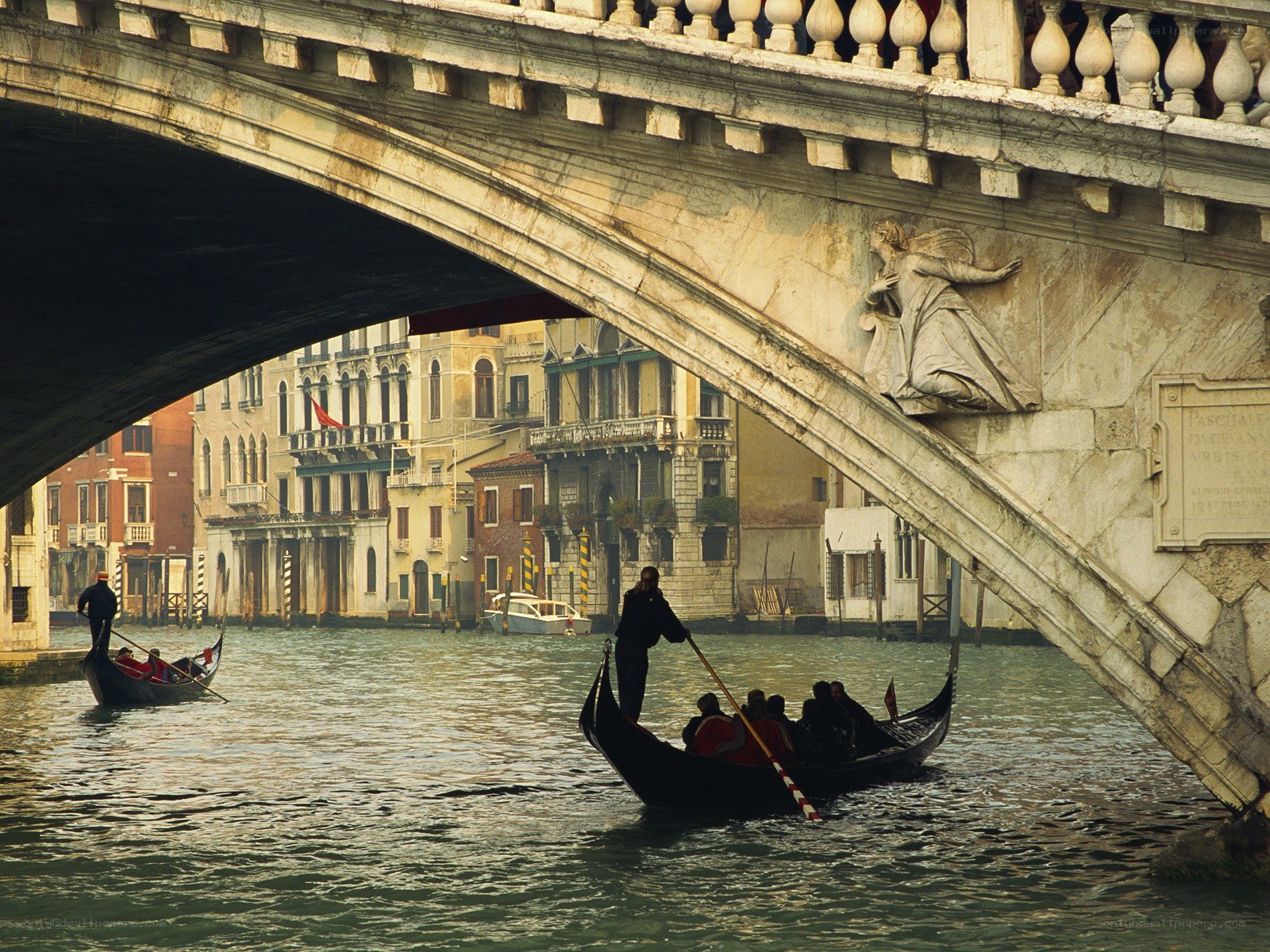 Gondolas under a Venetian bridge