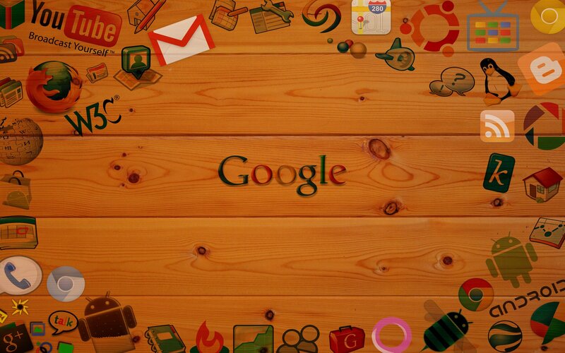 Google and tech icons on wood