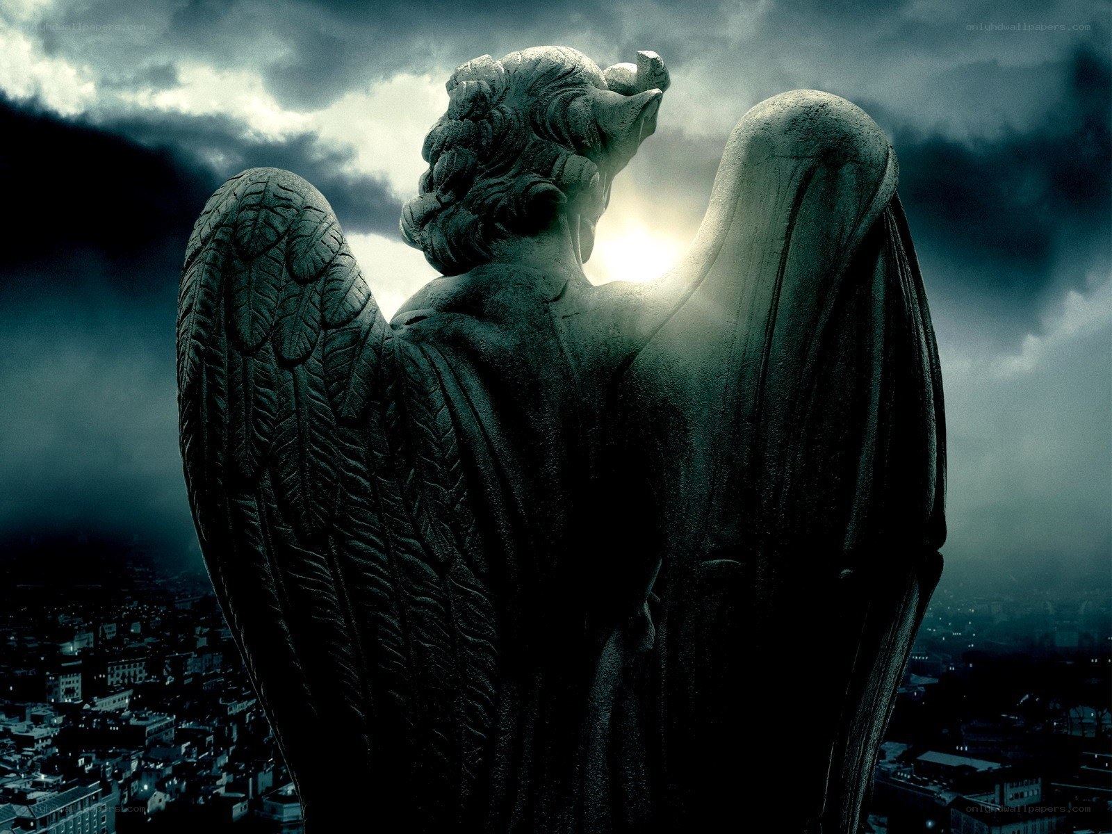 Gothic angel statue at night