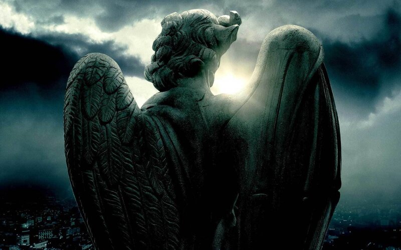 Gothic angel statue at night