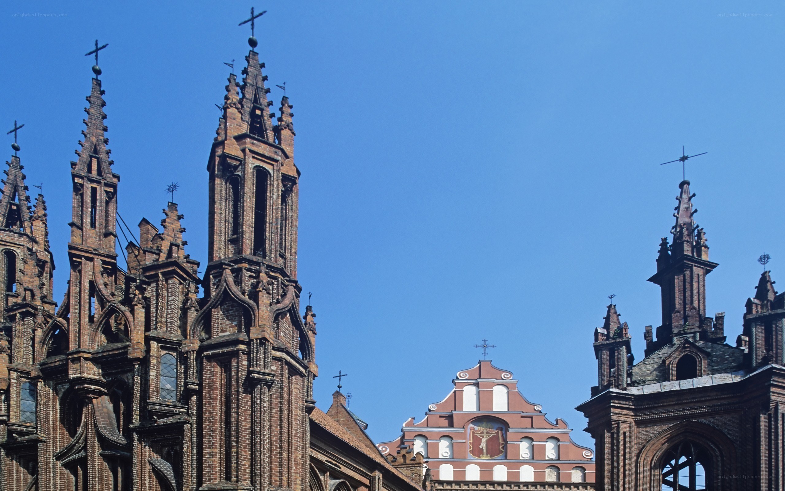 Gothic church spires under blue sky