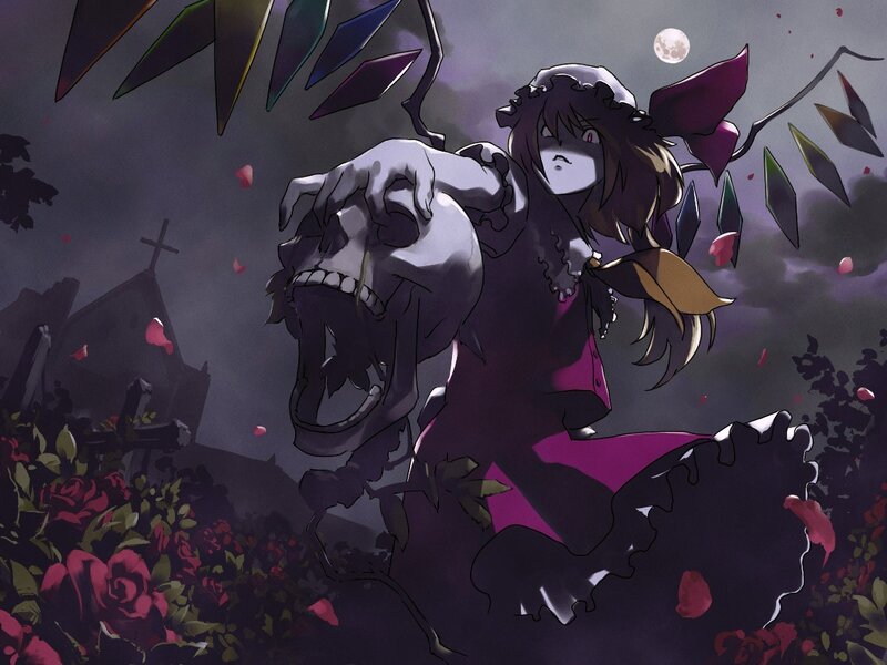 Gothic girl with skull in cemetery