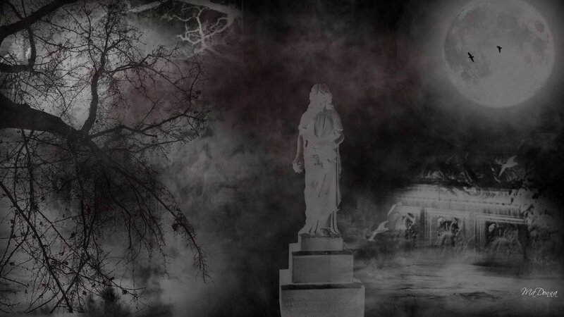 Gothic statue in moonlit cemetery