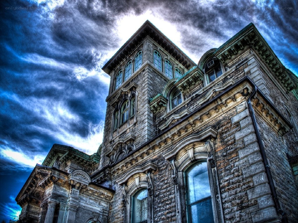 Gothic stone building under stormy sky