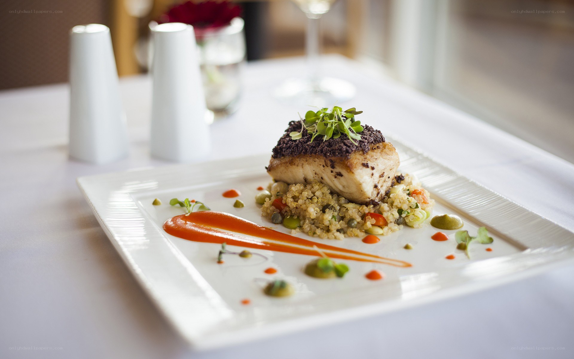 Gourmet fish dish on white plate