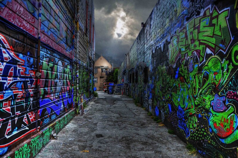 graffiti alley under stormy sky