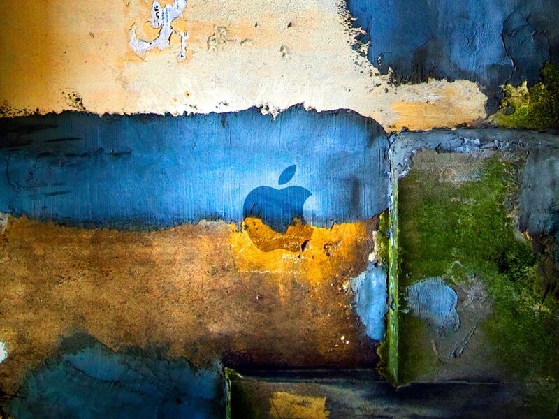 graffiti apple logo on wall