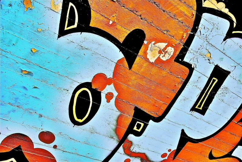 graffiti art on weathered wood