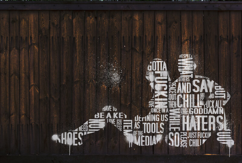 graffiti art on wooden wall
