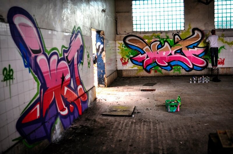 Graffiti artist in abandoned building