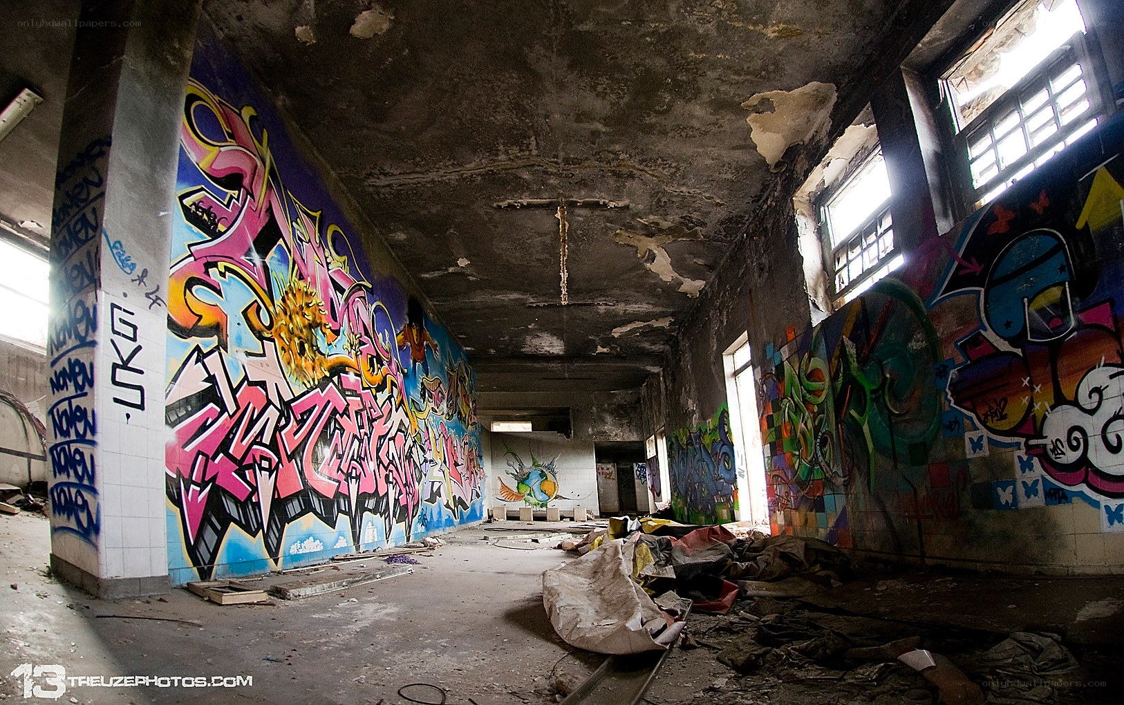 graffiti-covered abandoned hallway