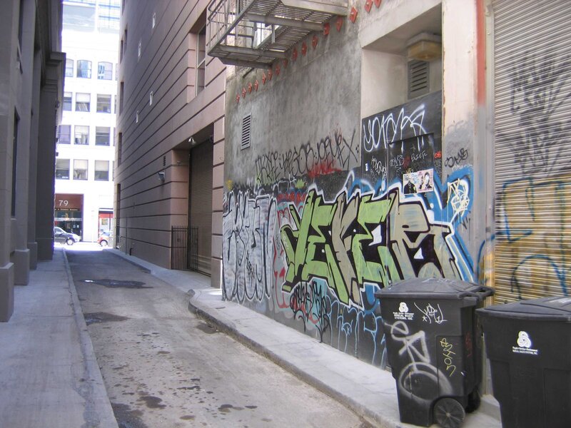 graffiti-covered alley in city