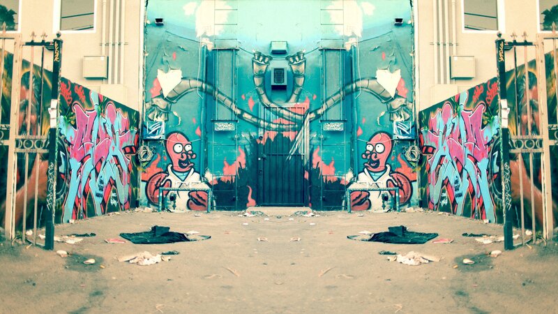 graffiti-covered alley with cartoon characters