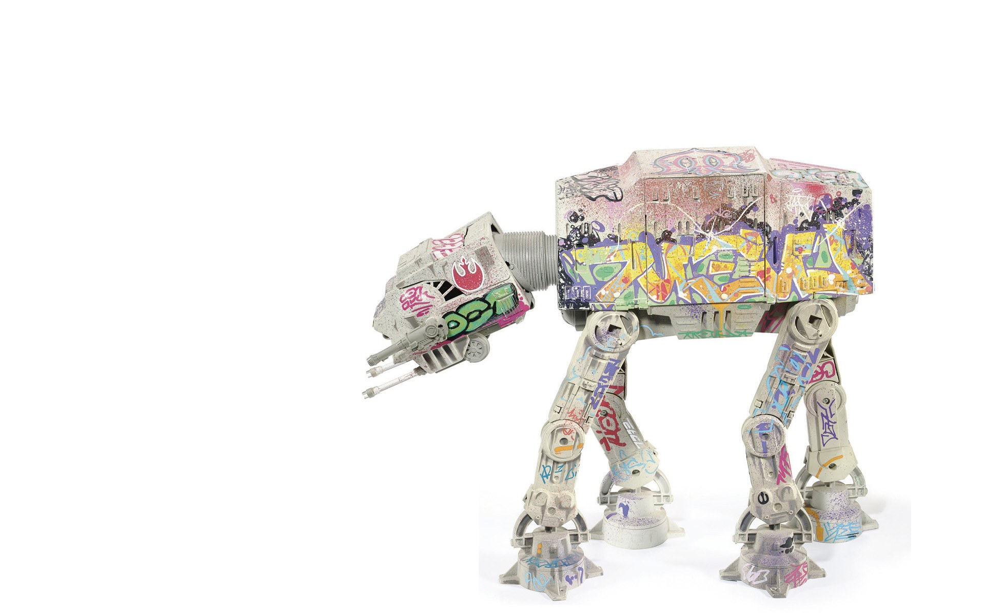 graffiti-covered at-at toy