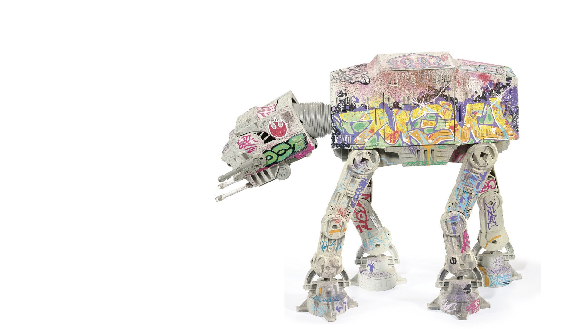 graffiti-covered at-at toy