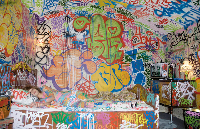 graffiti-covered bedroom