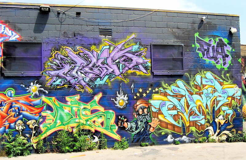 graffiti-covered brick wall