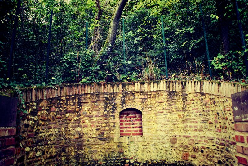 Graffiti-covered Brick Wall — Green
